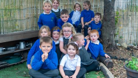 A group of early years pupils sack in the Nature Garden